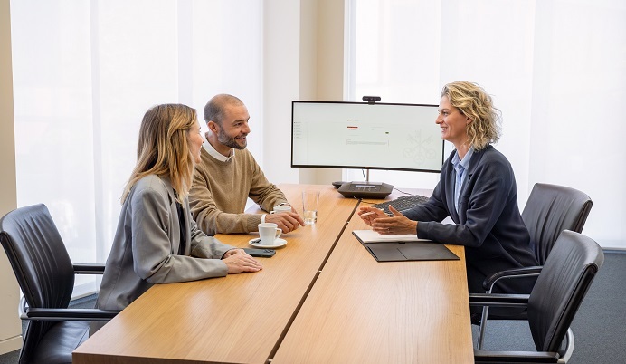 Clients sitting with advisor